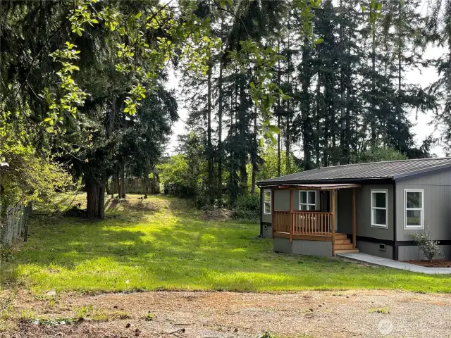 Huge side yard and Surrounded by trees.