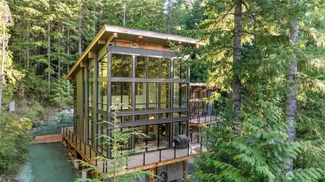 The deck allows you to walk completely around the house and access the guest cobin as well.