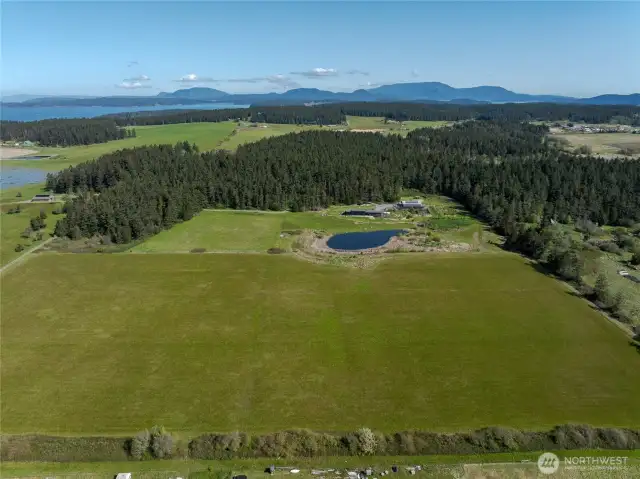 Birdseye view of the entire property with pasture on the south and a small area of woods on the north.