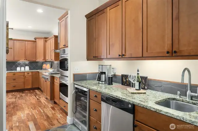 The butler's pantry includes a beverage cooler & wet bar.