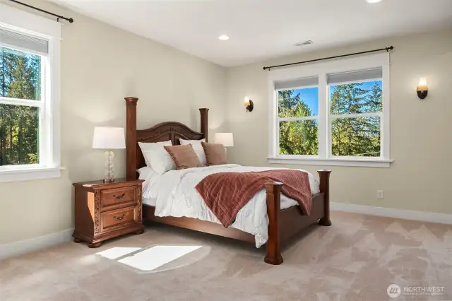 Your primary suite enjoys lush, natural scenery.