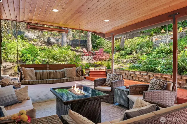 Step out your covered outdoor living area with heat lamps & recessed lighting.