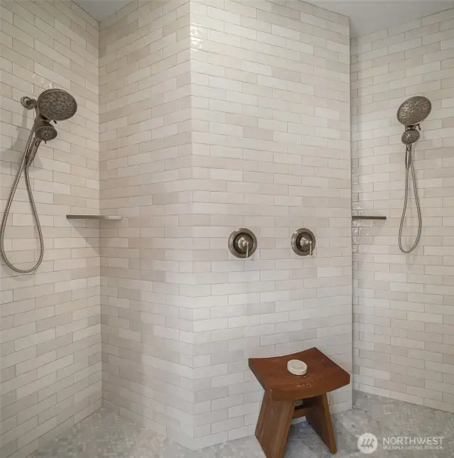 Your double walk-in shower is dressed in exquisite tile.