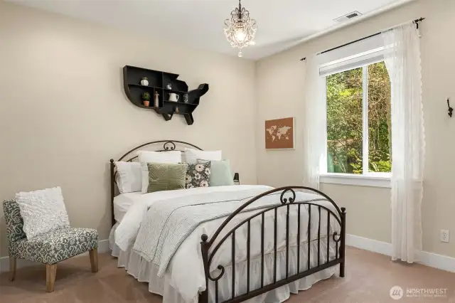 Just down the hall, this 2nd bedroom suite includes its own full bath.