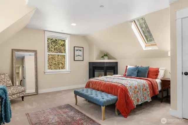 The 4th bedroom offers its own fireplace along with a bright skylight.