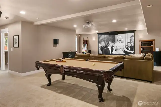 Elevate your movie nights with space for your home theater + billiards table.