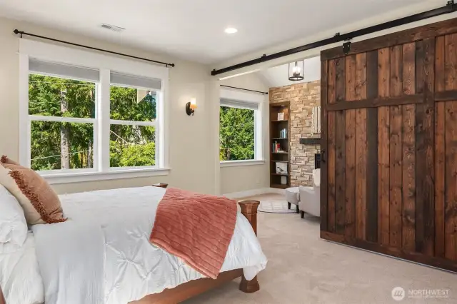 A barn door slides to reveal your vaulted sitting area.