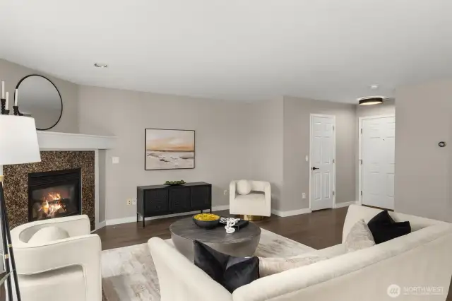 The half-bath lies behind the closed door by the foyer.