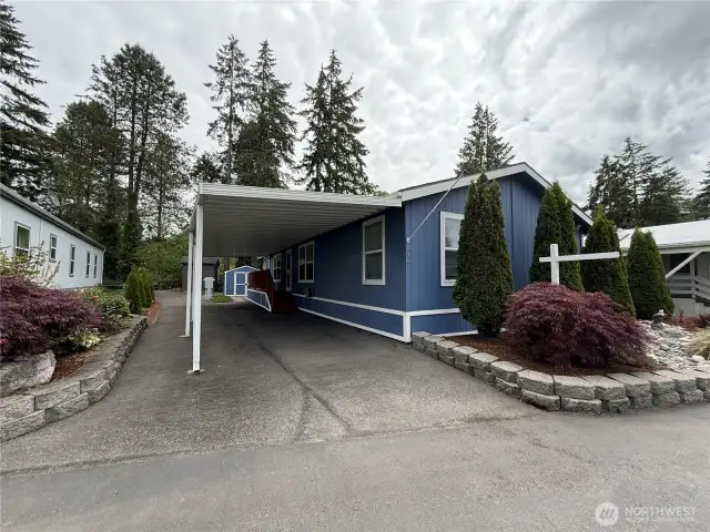 Carport for 2 but fits 3 if you squeeze.