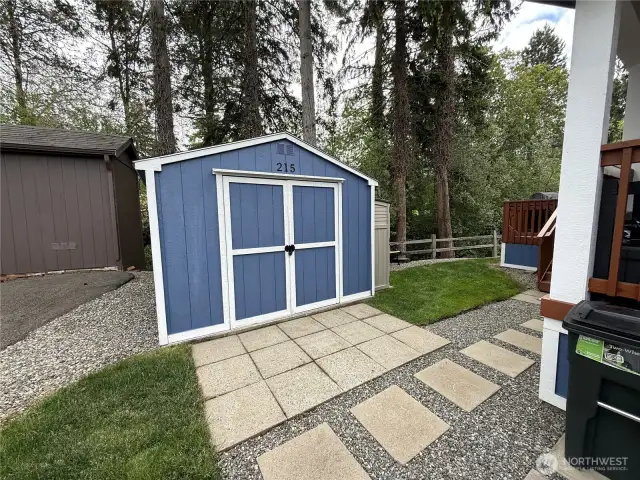 Power and patio work space with this shed.