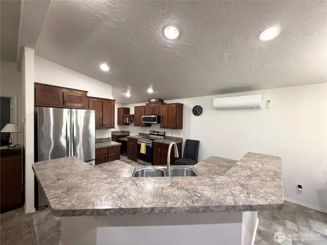 Lots of pull out drawers in kitchen.