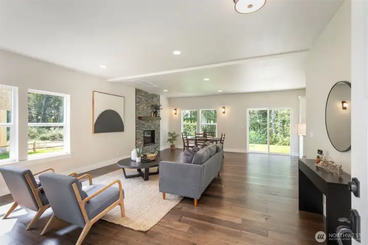 Welcoming open floor plan with engineered wood floors throughout. Welcoming open floor plan with engineered wood floors throughout.