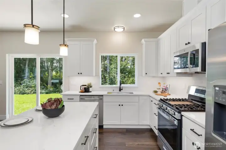 Modern kitchen with views to a private backyard.