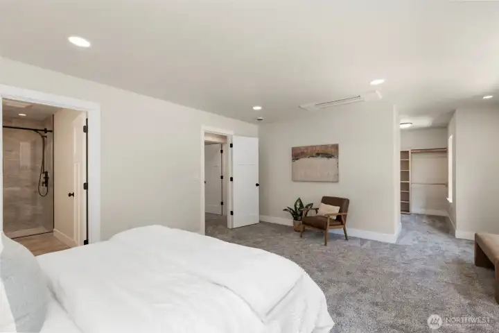 Primary suite with views to the bathroom and walk-in closet.