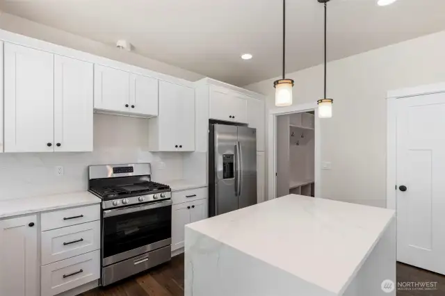 Stainless appliances.  Gas cooktop with griddle.  Microwave will be installed above the cooktop.
