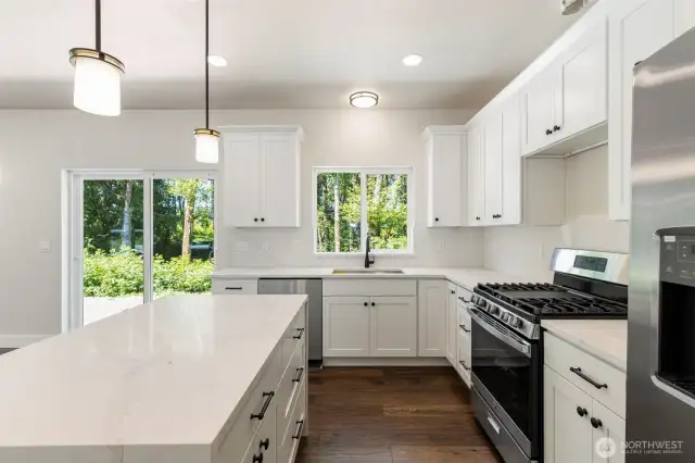 Modern kitchen with views to a private backyard.
