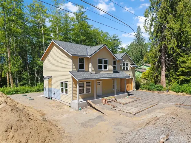 Concrete driveway and steps currently being installed.  Great curb appeal is only weeks away.