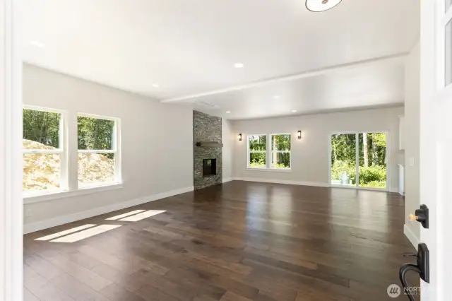 Welcoming open floor plan with engineered wood floors throughout.