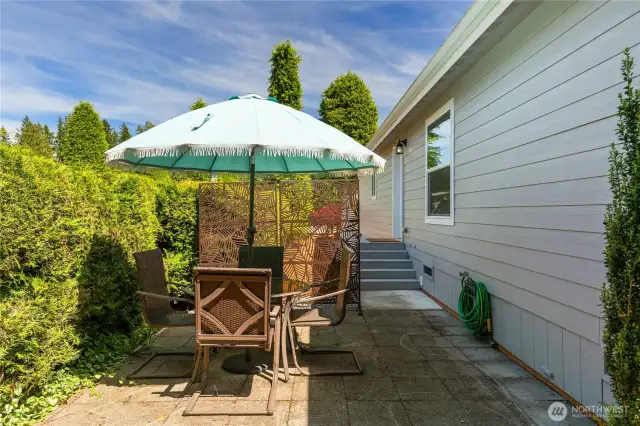 Looking back toward the side of the home there is a nice patio with room for a table.
