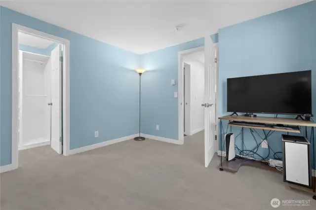 Generously sized primary suite featuring a walk-in closet and direct access to a shared continental bath — your personal retreat awaits.