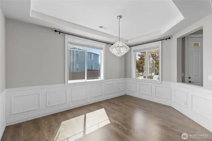 Dining Room with Fine Touches Such as Wainscoting and a Beautiful Chandelier Will Be Sure to Dazzle Your Guests.