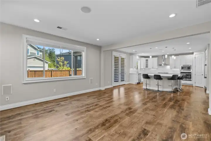 Spacious Living Room, Kitchen and Extra Tall Double-Doors Open to the Backyard Patio, Inviting the Inside Out. Open Concept Living at its Best!