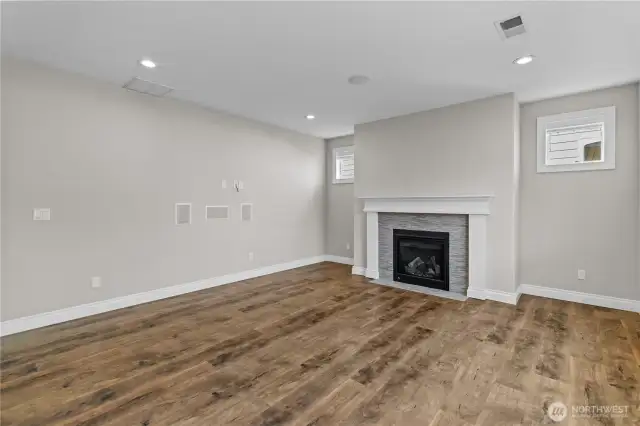 The Living Room Features a Cozy Gas Fireplace, Surround Sound for Entertainment or Movie Nights and Spacious Mantle Space for Art and Decor.