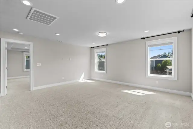 Family Room Features a Large Wall Space for a Big Screen. Cozy up with the Family for Movie Nights.