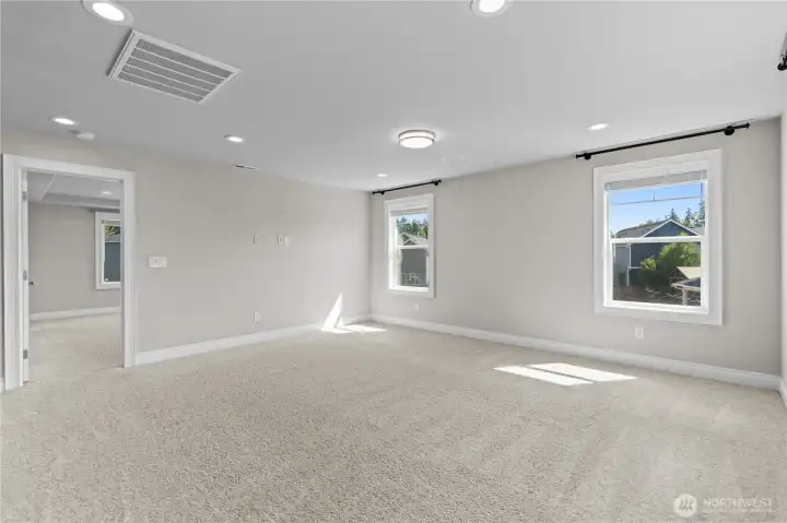 Family Room Features a Large Wall Space for a Big Screen. Cozy up with the Family for Movie Nights.