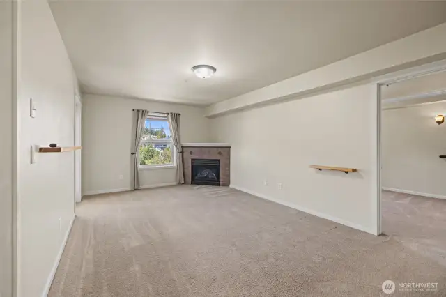 View of Living room with  primary bedroom to the right