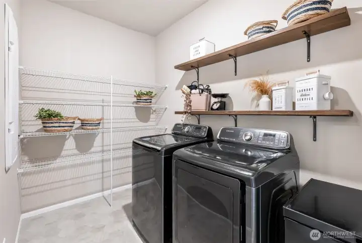 Large laundry room with plenty of room for storage