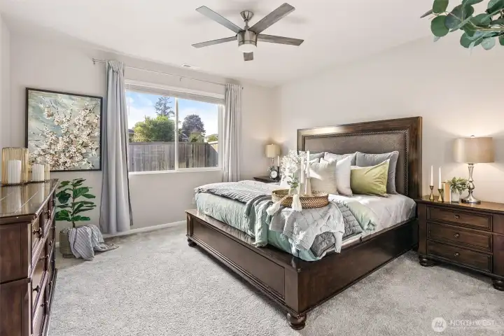 Primary bedroom with ceiling fan