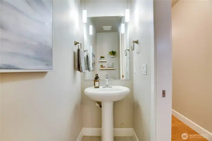 Tucked for privacy yet easily accessible, the half bath is a polished addition to the home’s thoughtful layout.