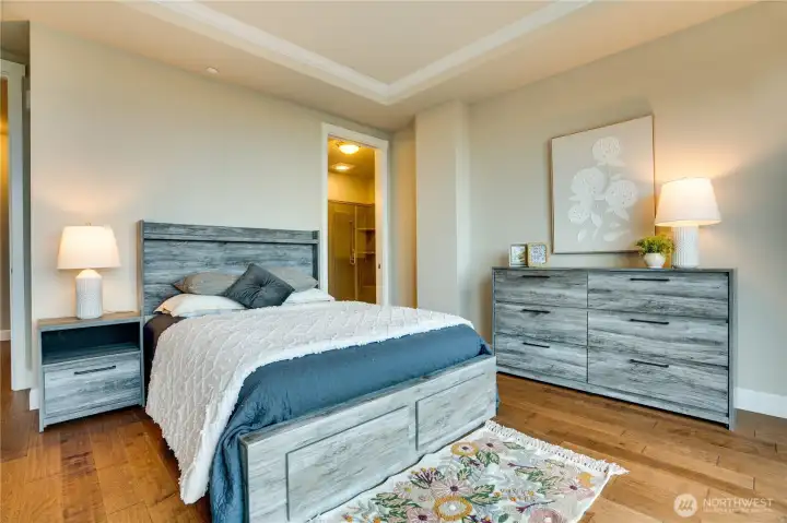 Freshly painted and quietly tucked away, this serene primary features elegant crown molding and ample room for a reading chair, dresser, or a personalized retreat.