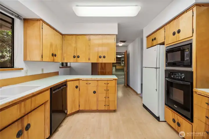 spacious country kitchen with maple hardwood floors