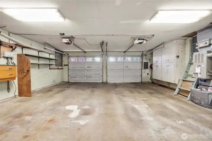 Large 2 car garage with storage on the sides