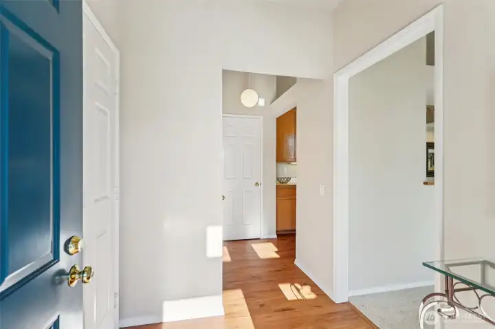 Foyer and kitchen have laminate flooring.