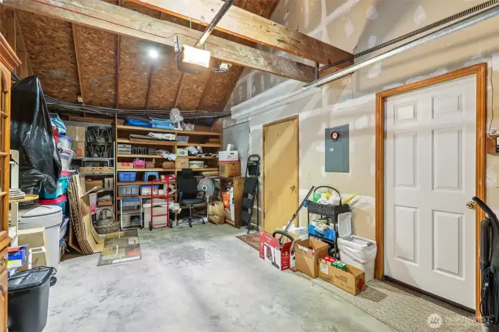 BIG garage with built in shelves. Cathedral ceilings for additional storage as needed by new buyer.