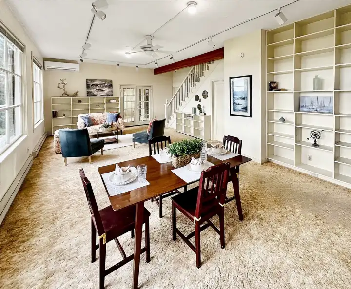 4403...Formal area with built-in book shelves, French doors to library, and large picture windows to enjoy the northwest views.