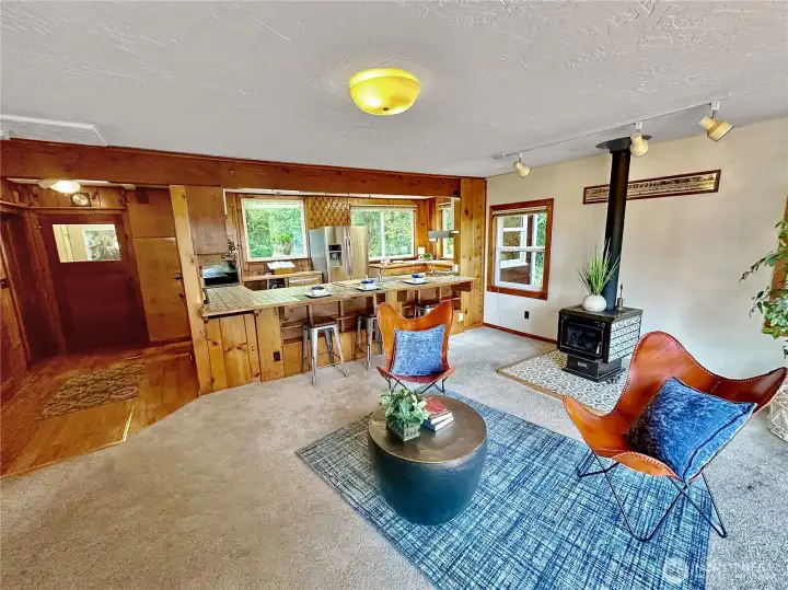 4403...Another family room view.  Here we see the access from the front of the house, eating bar and open kitchen.