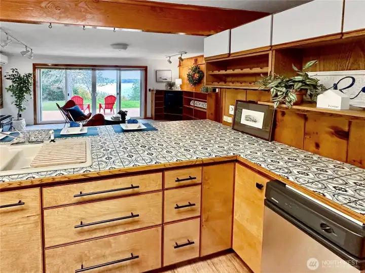 4403...The kitchen offers a view of the family room, deck and outdoors with sound, sunsets and boat traffic views!