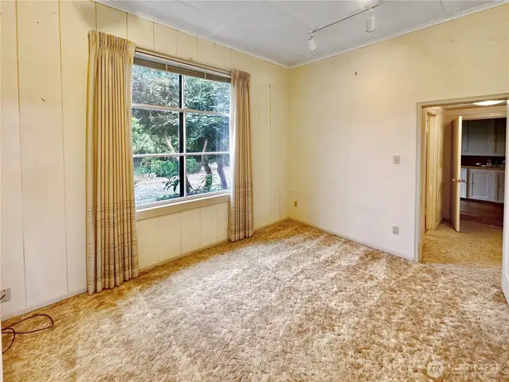 4403...Main floor den or overflow guest space with easy access to full, main floor bath.