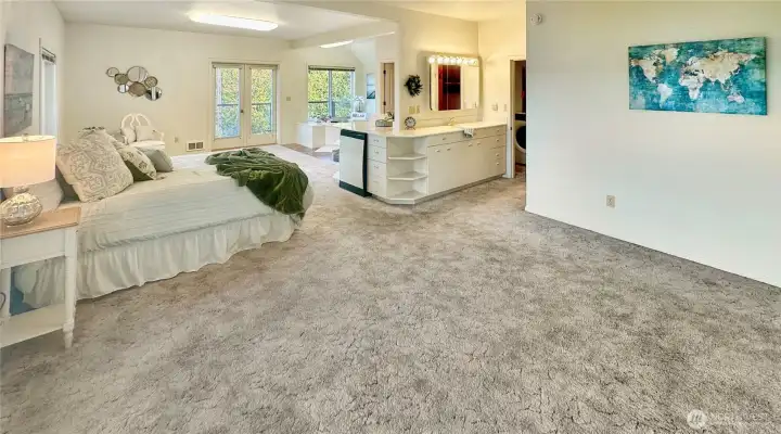 4403...Upper floor primary suite with lots of space features private balcony, 5 piece bath and laundry area.