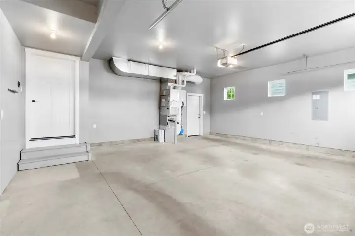 Two car garage with small storage room