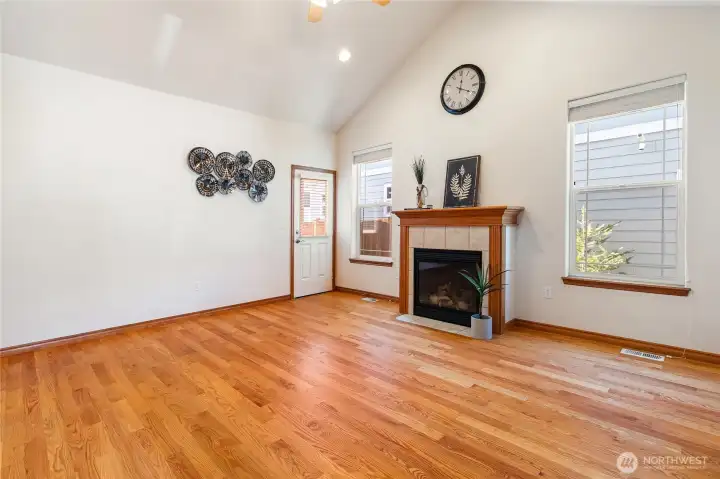 Beautiful hardwood floors warm this space nicely with a convenient patio access door leading to the backyard.