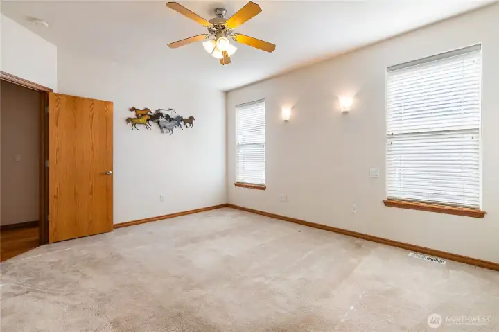 Large Primary Bedroom with ceiling fan to keep you cool during the warm summer months.