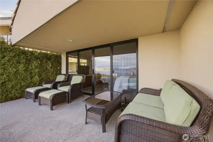 Oversized patio off primary suite ideal for lounging and enjoying the day.