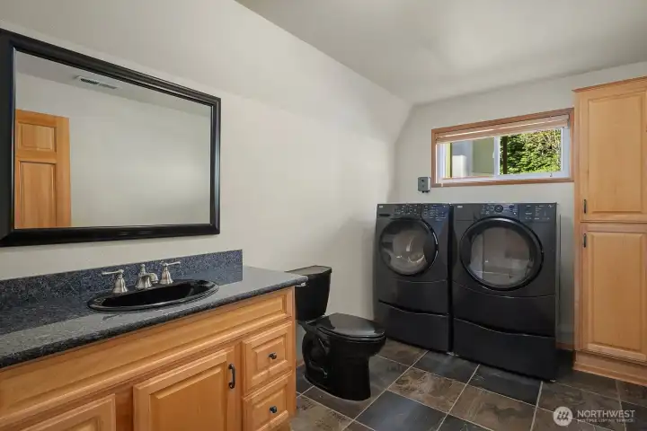 Lower level utility room with half bath,
