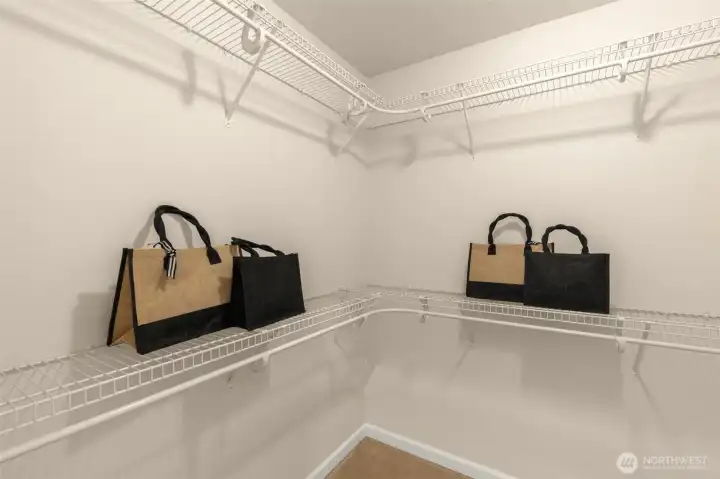 spacious his & her walk-in closets
