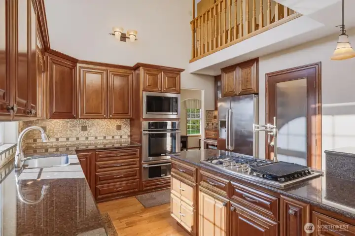 Custom kitchen with pot filler and propane cook top.